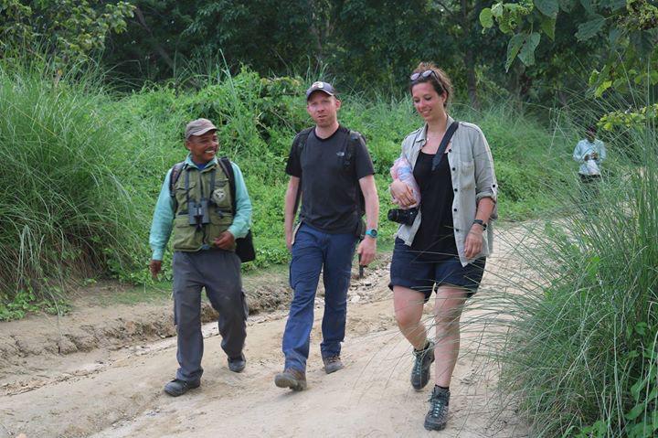 customers exploring chitwan national park on foot